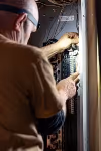 Electrician Replacing an Electrical Breaker in NH