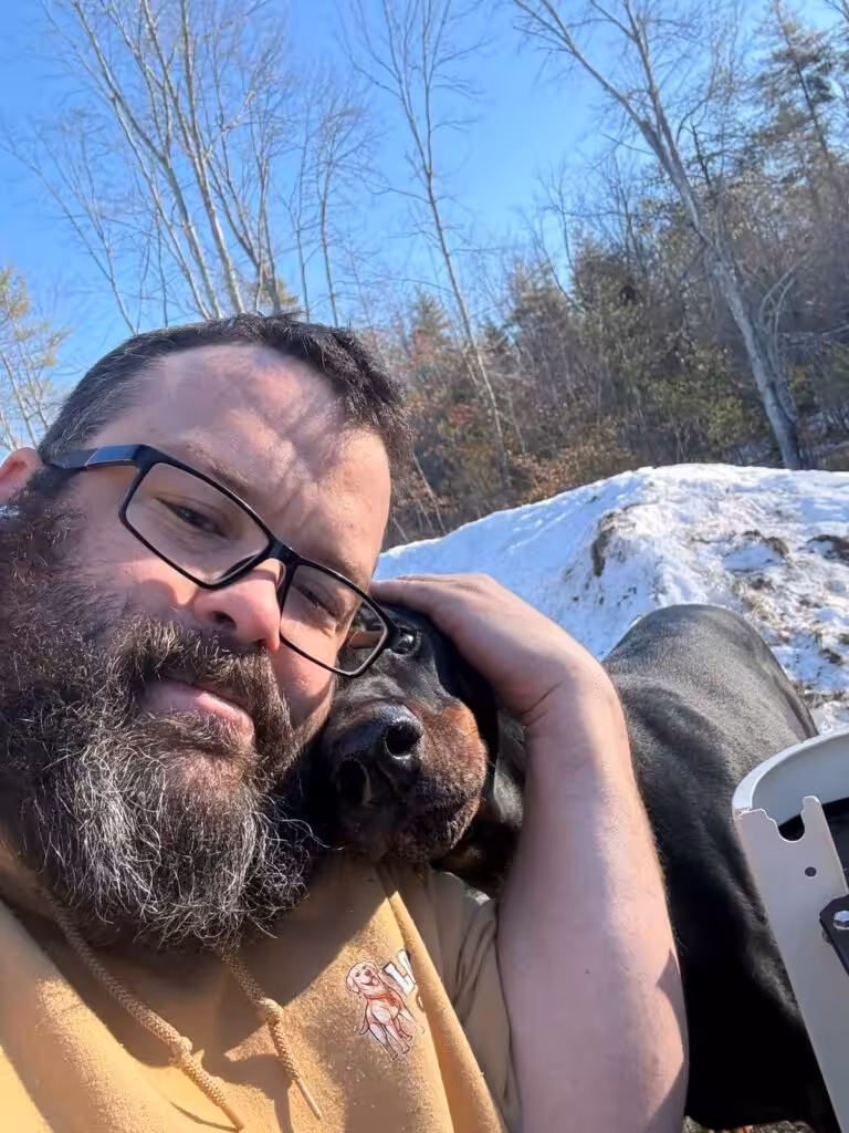 Clay, Field Supervisor at Loyal Lab Electric & Generators, with a dog in Somersworth NH — the Rusty Fund reflects the values of the entire Loyal Lab team