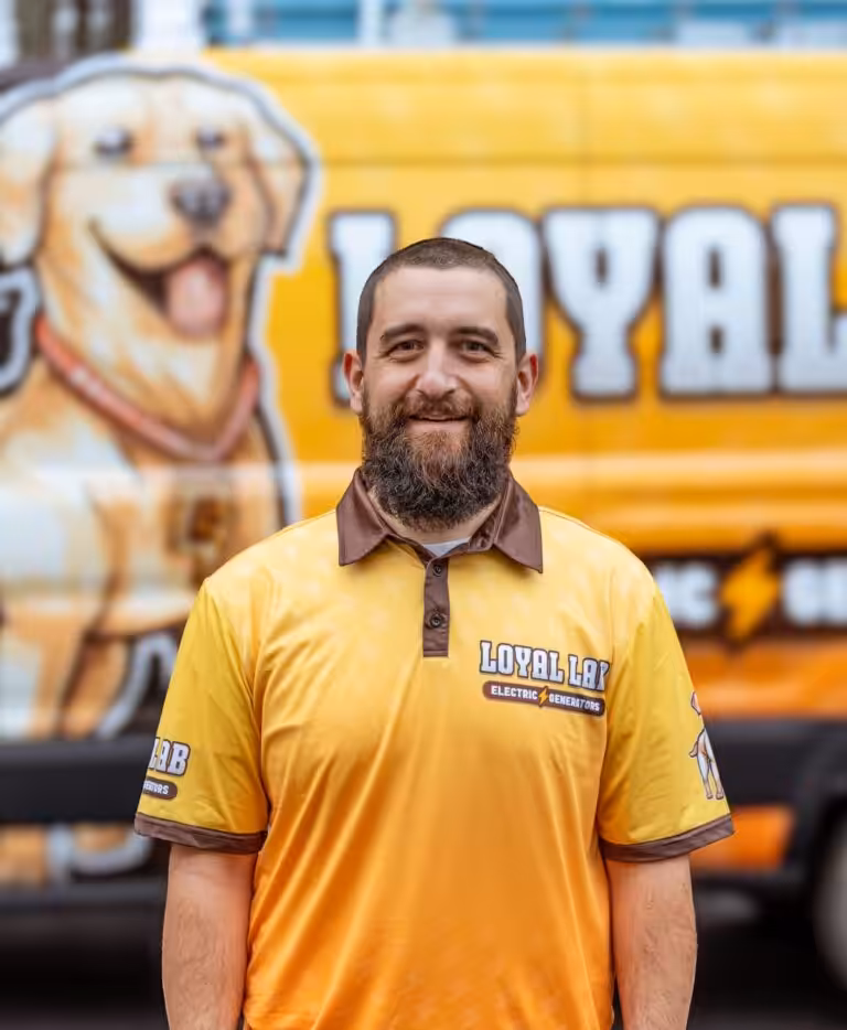 Eric Hope, owner and NH Master Electrician at Loyal Lab Electric & Generators, in front of the Loyal Lab service van in Somersworth NH