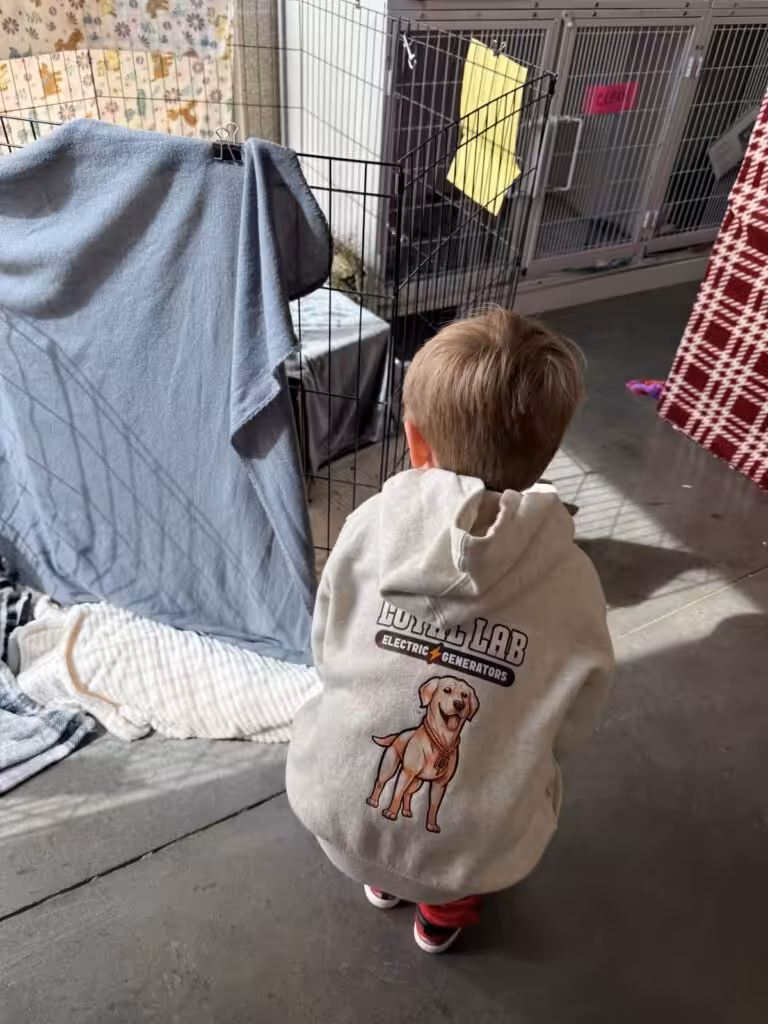 Jaxson Hope visiting animals at Pope Memorial Humane Society in Dover NH — the Rusty Fund supports shelter dogs across the NH Seacoast through Loyal Lab Electric & Generators